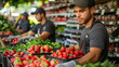 © aekkorn - Workers stocking store shelves with fresh products/produce.