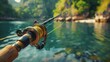 Fishing rod set against a backdrop of a beautiful and cool river scene, capturing the tranquility and excitement of angling in nature's embrace.
