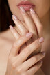 © verona_studio - Beautiful Young Woman With Healthy Skin And Manicure. Woman Natural Makeup And Care For Hands Cosmetics. Manicure And Hands Spa. Cosmetology, Beauty. Skin Care.