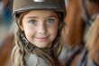 Happy girl kid at equitation lesson looking at camera while riding a horse, wearing horseriding helmet, Generative AI
