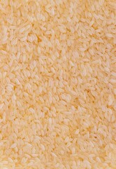 Wall Mural - Top View of Rice Heap Background with Copy Space in Vertical Orientation