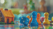 colorful board game setup featuring dice, pawns, and figurines