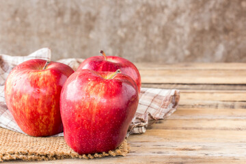 fresh red apple on wooden table