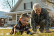 Grandfather playing with grandson on the lawn