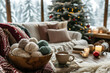 © Tina - a wooden bowl with woolen yarn balls inside standing on atable in a cozy living room at christmas time, outside is a snow covered landscape, still life