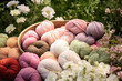 pastel colored woolen yarn balls in a wooden basket on a table in an amazing garden