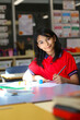 © Austockphoto - Student with Indian ethnicity doing maths in the classroom