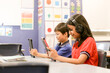 © Austockphoto - students in the classroom with headphones and iPads