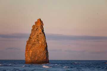 Wall Mural - Kunashir. Rock Devil's finger at sunset