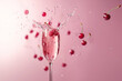 Red cherry falling into a glass of champagne producing water splash isolated on soft color background.