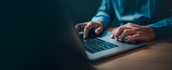 internet, keyboard, working, information, security, network, office, person, data, communication. A person is typing on a laptop computer. Concept of productivity and focus.