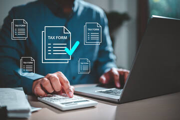 Wall Mural - calculate, tax, document, invoice, keyboard, paperwork, report, research, revenue, refund. A man is using a laptop to fill out tax forms. Concept of the importance of accurately completing tax forms.