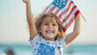 Laughing Child with Sun-kissed Cheeks Holding American Flag