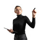 © Who is Danny - A young woman in a black turtleneck and pants holding a tablet and a marker, appearing to write or draw in the air, isolated on a white background, illustrating the concept of business or education