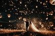 Enchanted Evening Wedding Scene with Sky Lanterns Illuminating the Night Sky