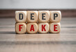 Cubes, dice or blocks with deep fake, deepfake on wooden background