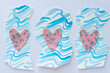 abstractly cut paper shapes with blue wavy lines and pink hearts with floral pattern