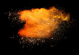 Fototapeta Motyle - Abstract powder splatted background. orange powder explosion on black background. Colored cloud. Colorful dust explode. Paint Holi