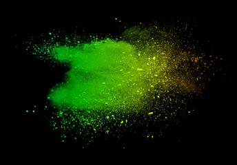 Wall Mural - Abstract powder splatted background. Green powder explosion on black background. Colored cloud. Colorful dust explode. Paint Holi