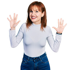 Poster - Redhead young woman wearing casual turtleneck sweater showing and pointing up with fingers number ten while smiling confident and happy.