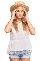 Canvas Print - Young blonde girl wearing summer hat with hand on head for pain in head because stress. suffering migraine.