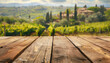 Empty wooden table for product display with blurred Italian vineyards and cypresses in the background