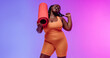 © gstockstudio - Happy African plus size woman in sportswear carrying exercise mat and smiling on vibrant background