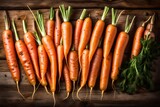 Fototapeta  - carrots on a wooden background