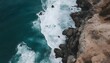 Aerial view from above of ocean, rocks and water waves