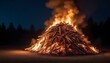 a burning pile of wood in the night