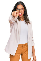 Canvas Print - Young african american girl wearing business clothes pointing displeased and frustrated to the camera, angry and furious with you