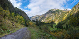 Fototapeta Tulipany - Oytal valley with colorful trees in autumn, landscape near Oberstdorf, allgau alps