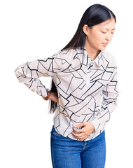 Sticker - Young beautiful chinese woman wearing casual shirt suffering of backache, touching back with hand, muscular pain