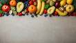 A variety of fruits and vegetables are arranged in a row with copy space