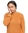 Young brunette woman wearing casual winter sweater thinking looking tired and bored with depression problems with crossed arms.