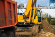 The excavator digs a deep ditch