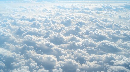 Sticker -  a view of the sky from an airplane window with a lot of clouds in the foreground and a bright blue sky in the background.