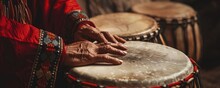 Close Up Of Red Indian Ceremonial Drums Hands In Motion Connecting Past With Present