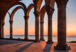 The iconic arches of a historic monument silhouetted against the soft hues of dawn, as the first light of morning gently kisses the horizon.