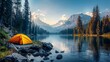 Small orange tent is set up by a lake in the woods. The scene is peaceful and serene, with the water reflecting the surrounding trees and mountains. The tent is a cozy spot for someone to relax