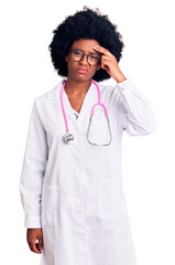 Sticker - Young african american woman wearing doctor coat and stethoscope worried and stressed about a problem with hand on forehead, nervous and anxious for crisis