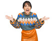 © Krakenimages.com - Young hispanic woman wearing casual clothes celebrating victory with happy smile and winner expression with raised hands