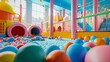 Indoor sports and play playground with a 360-degree view of the ball pit, slide, and plastic dry pool.  A vibrant play area for kids in a modern kindergarten or shopping center.