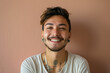 © Duckai - Transsexual man, female-to-male gender transitioned person with a smile and beard on a gay pride wall