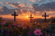 Three beautiful, flowery crosses on a hillside with a beautiful sunrise in the background, representing hope and resurrection.