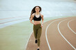 © Artur Didyk - Athletic girl run an training in stadium.
