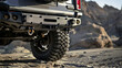 A reinforced rear bumper, with integrated steps and tow points, designed for heavy-duty towing and recovery