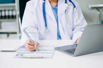 Wall Mural - Medical technology concept. Doctor working with mobile phone and stethoscope and digital tablet laptop in modern office at hospital