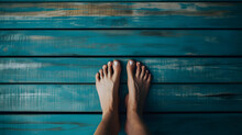 Human Feet On A Blue Wooden Floor With Space For Text