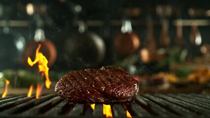 Sticker - Super Slow Motion of Falling Beef Steak on Grill. Filmed on High Speed Cinema Camera, 1000 fps. Kitchen with Utensils on Background.